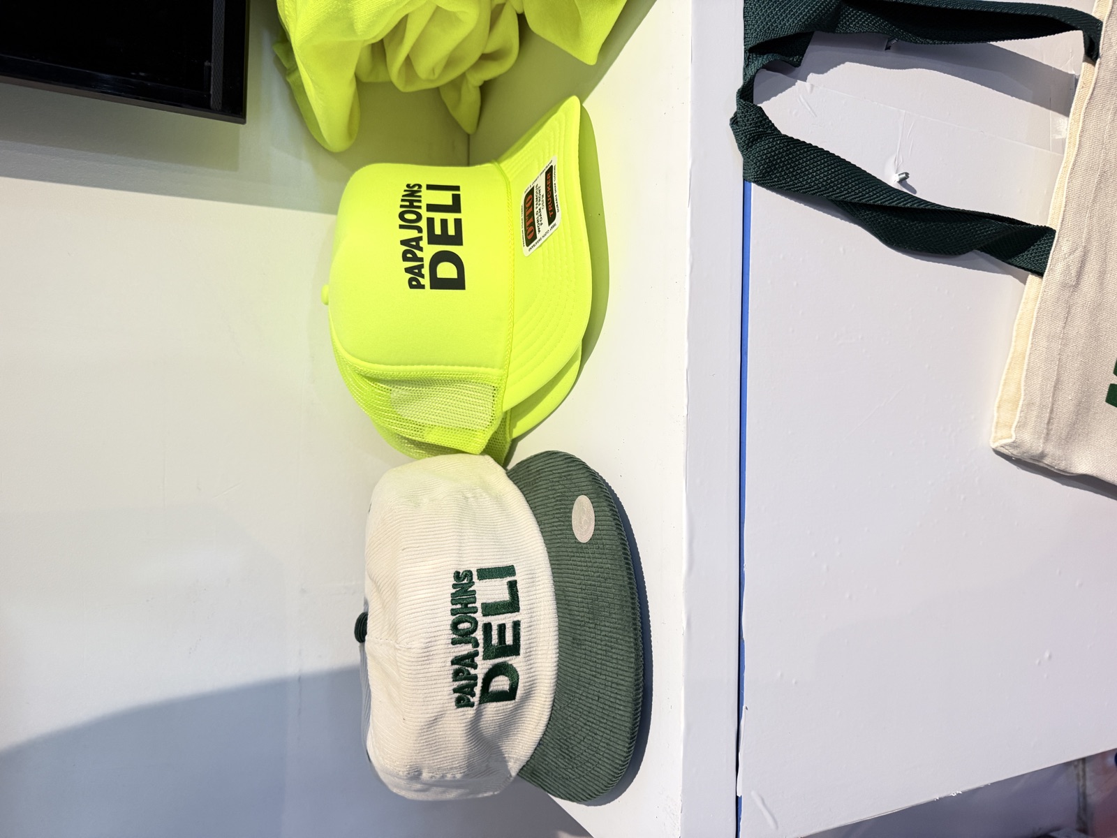 Finished shirts, hats, and event merch on display for Screen Printing At Events